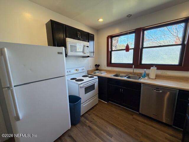 2670 Post Street, Unit 3 Jacksonville, FL 32204 - Photo 7 of 21 a kitchen with stainless steel appliances a refrigerator sink and wooden cabinets