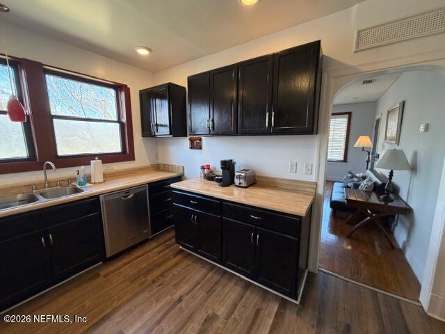 2670 Post Street, Unit 3 Jacksonville, FL 32204 - Photo 8 of 21 a kitchen with wooden cabinets a sink dishwasher and a stove with wooden floor