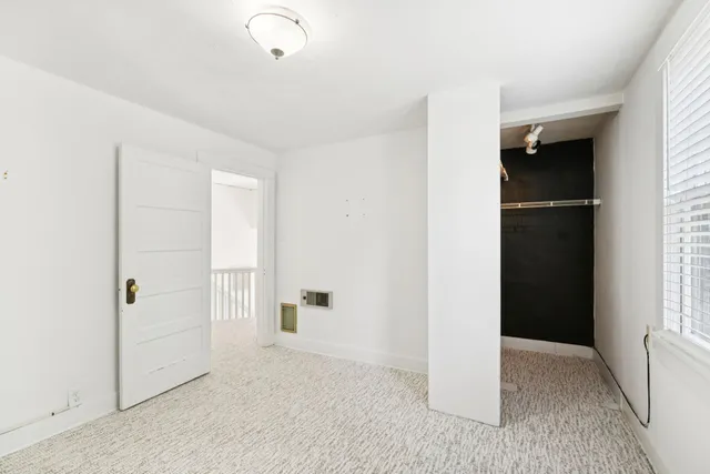 a bathroom with a sink mirror vanity and toilet
