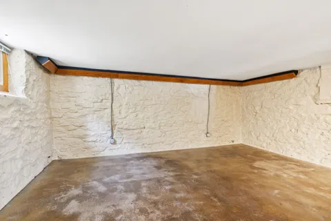 a view of a room with a table and windows