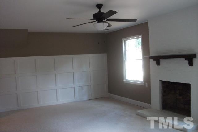 1325 Sedwick Road Durham, NC 27713 - Photo 12 of 16 wooden floor in an empty room with a fireplace