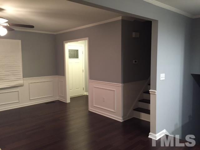 1325 Sedwick Road Durham, NC 27713 - Photo 5 of 16 an empty room with wooden floor and windows