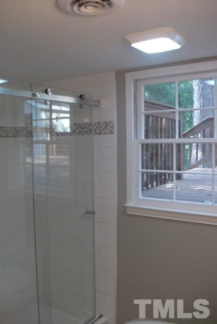 1325 Sedwick Road Durham, NC 27713 - Photo 9 of 16 a bathroom with a shower