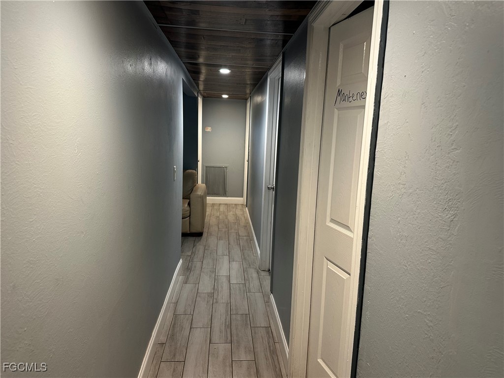 4505 Luckett Road Fort Myers, FL 33905 - Photo 11 of 19 a view of a hallway with wooden floor