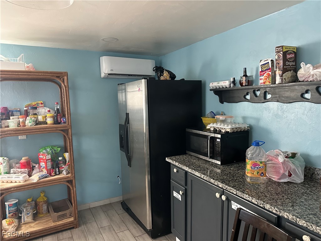 4505 Luckett Road Fort Myers, FL 33905 - Photo 16 of 19 a kitchen with a refrigerator and a stove