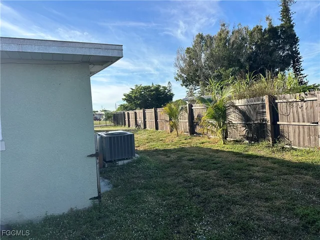 a bedroom with furniture and a wooden floor