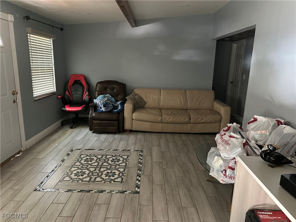 4505 Luckett Road Fort Myers, FL 33905 - Photo 8 of 19 a bedroom with furniture and a wooden floor