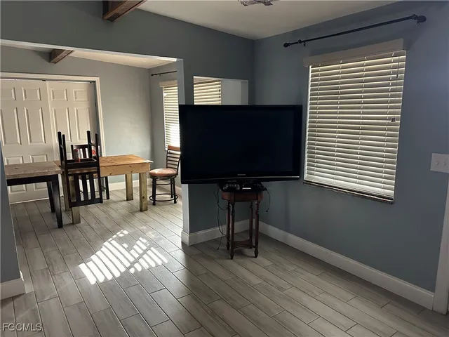 a bed room with a bed furniture and a window