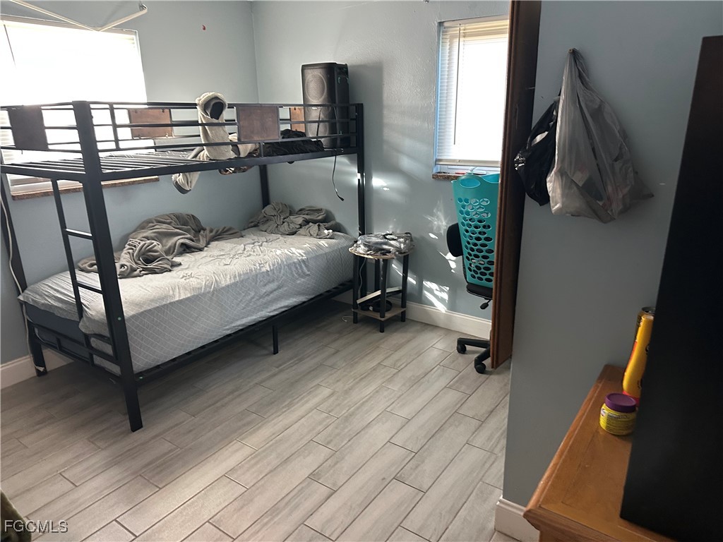 4505 Luckett Road Fort Myers, FL 33905 - Photo 10 of 19 a bed room with a bed furniture and a window