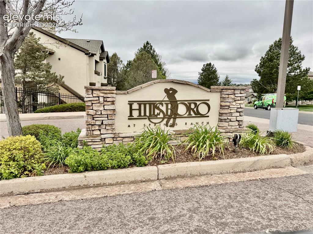 3748 Riviera Grove, Unit 203 Colorado Springs, CO 80922 - Photo 23 of 23 a sign on the side of a building