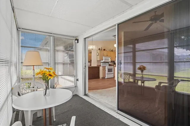 a house view with swimming pool in front of it