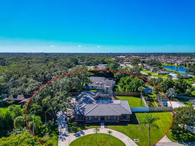 an aerial view of a house with a garden