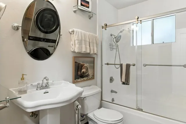 a bedroom with furniture and a chandelier