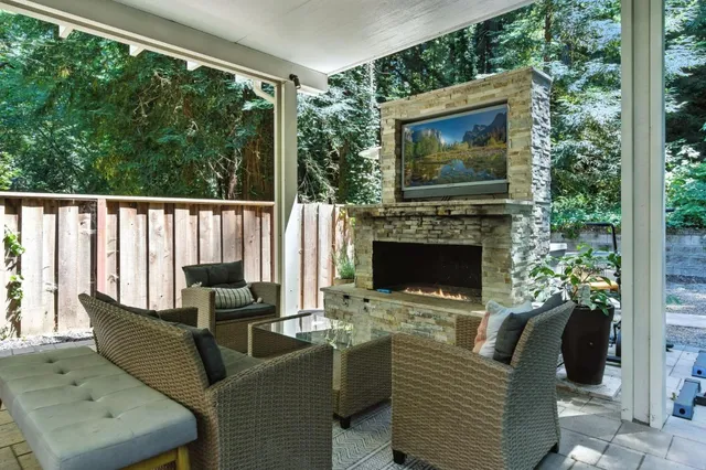 a wooden bench sitting in the middle of a yard
