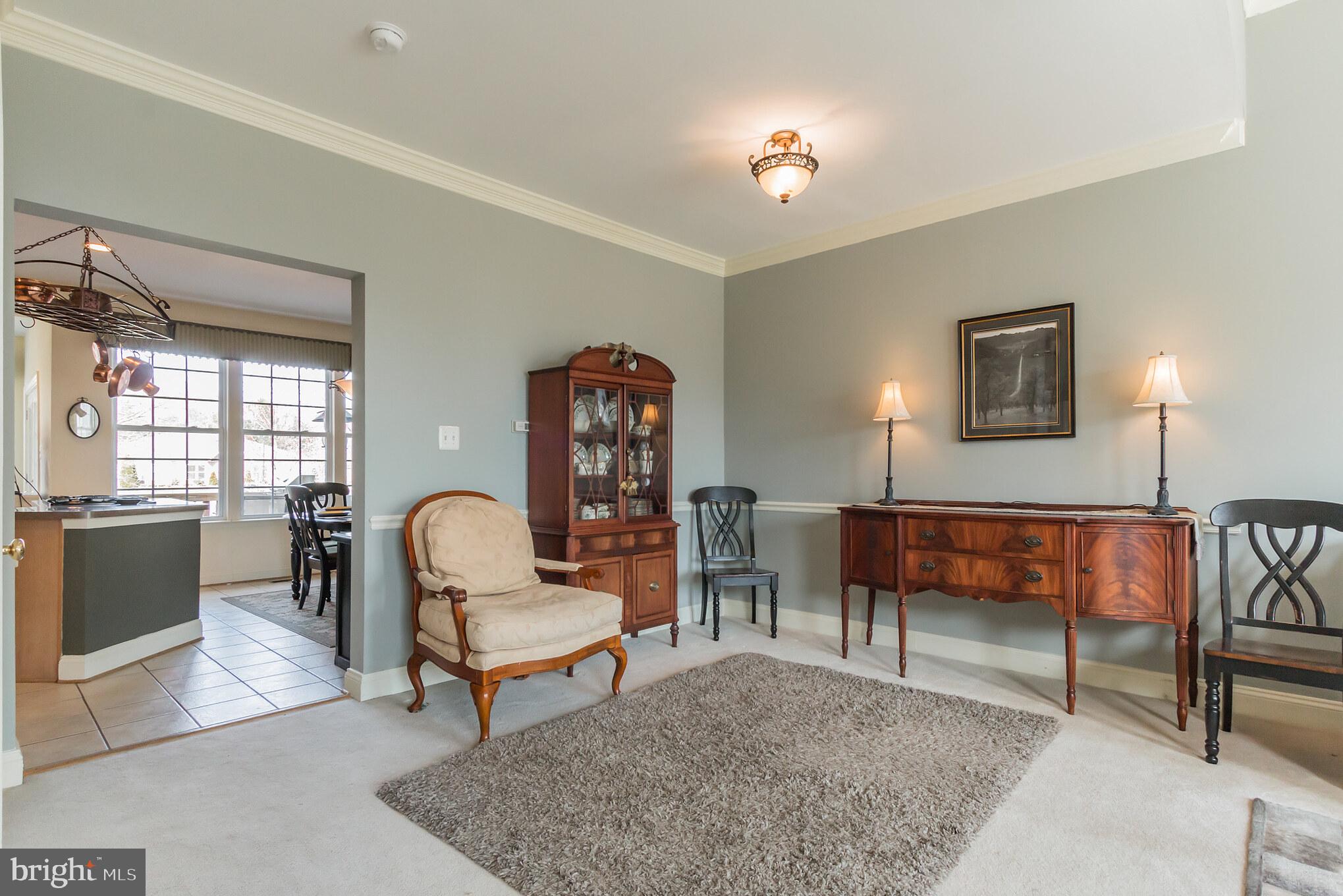 613 Springhouse Square Southeast Leesburg, VA 20175 - Photo 5 of 36 Formal dining room with chair rail, crown molding