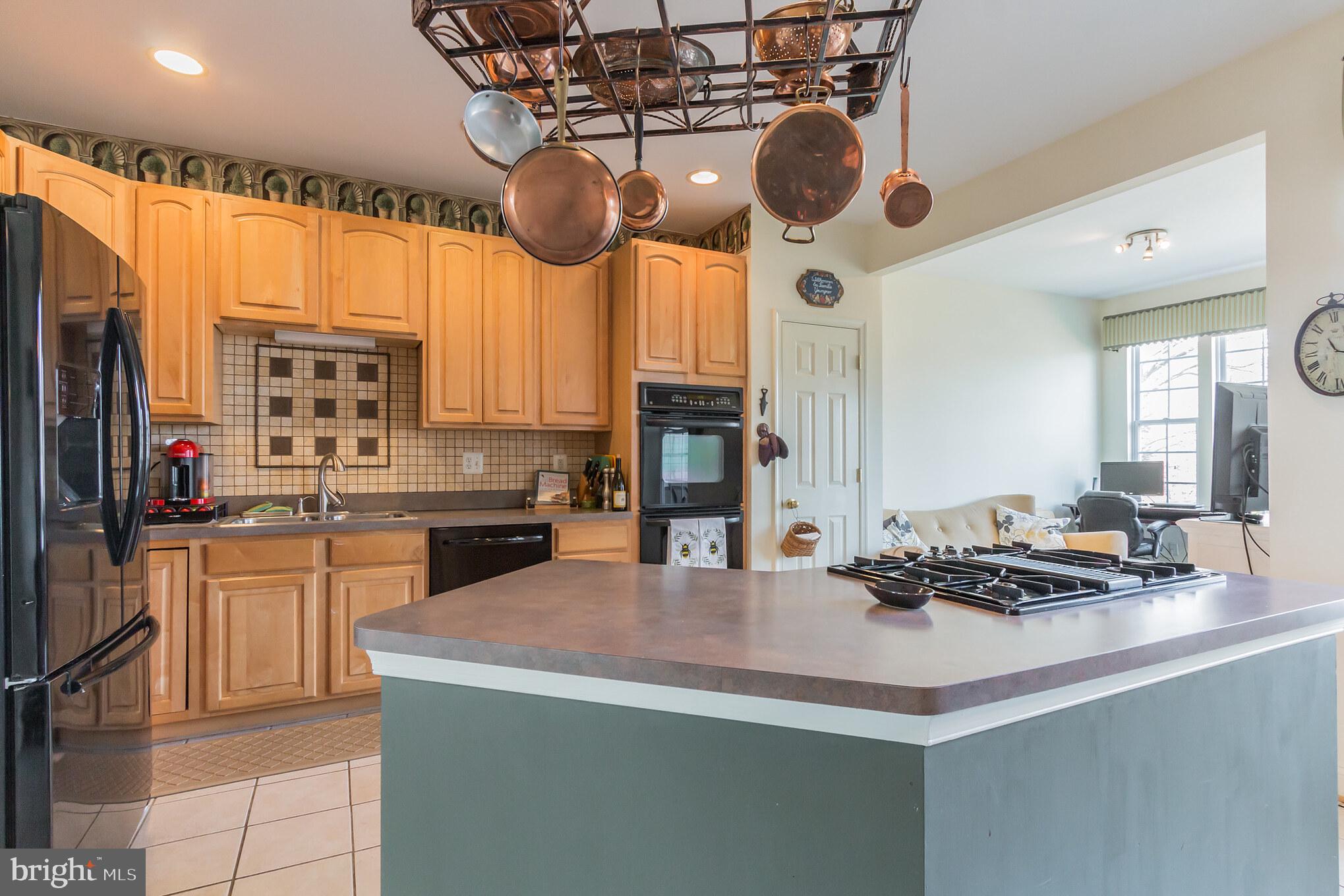613 Springhouse Square Southeast Leesburg, VA 20175 - Photo 9 of 36 Center island with gas cooktop