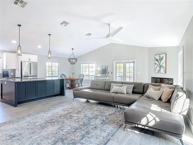 a bedroom with a bed chair and a window