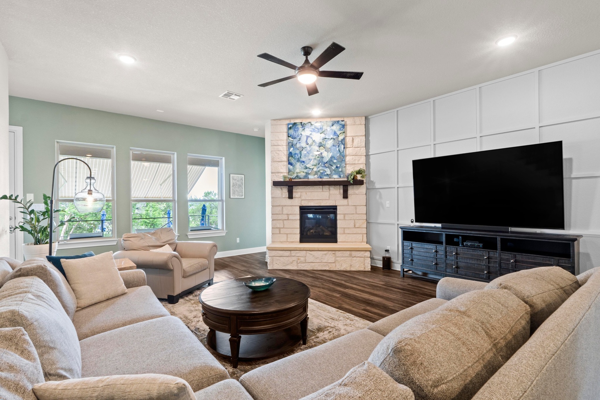 1329 Siena Sunset Road Leander, TX 78641 - Photo 5 of 33 Family room with view of the large covered porch, pool and greenbelt. Windows bring the outdoors in.