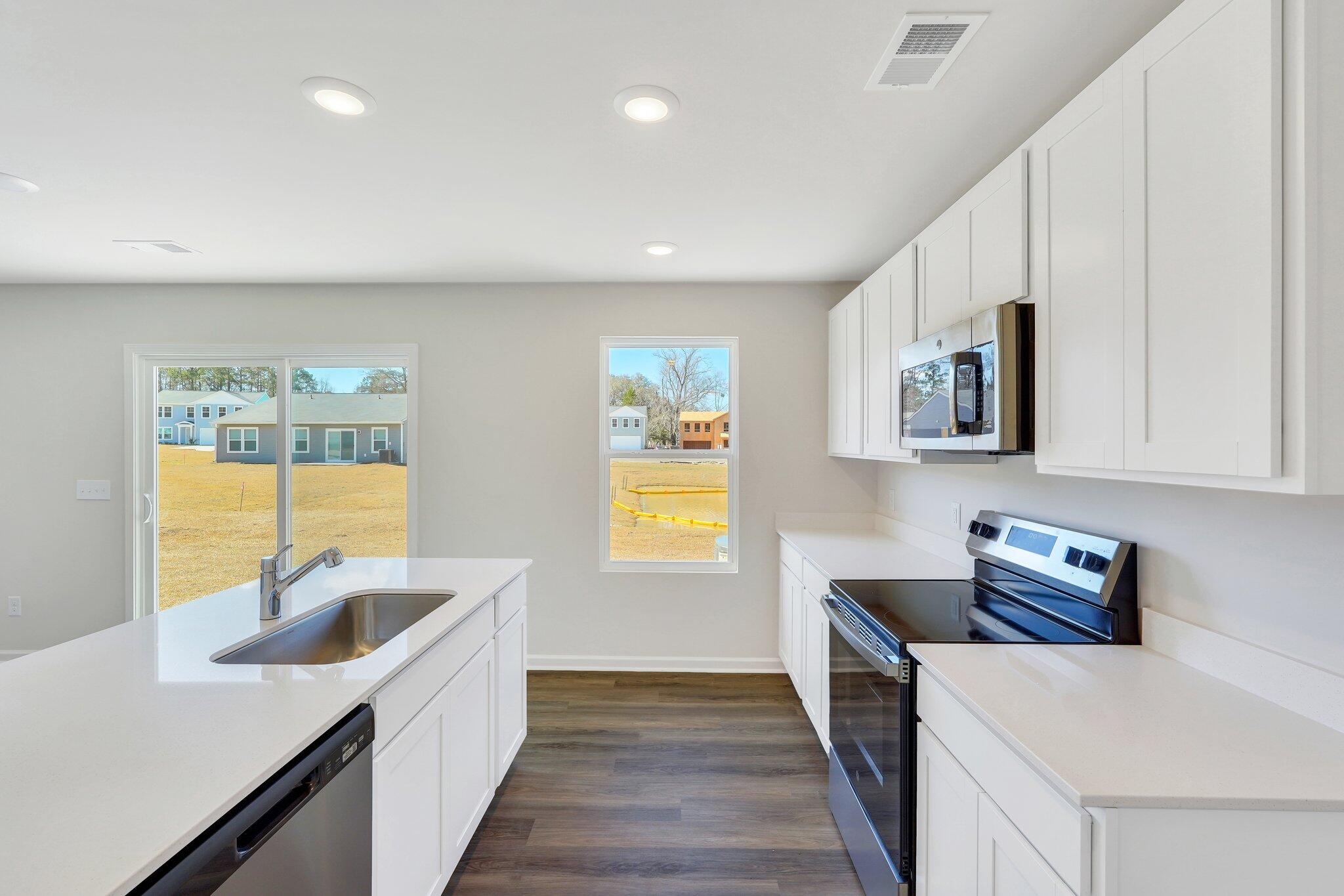 7059 Windham Way Ladson, SC 29456 - Photo 13 of 58 DINING OPEN TO KITCHEN