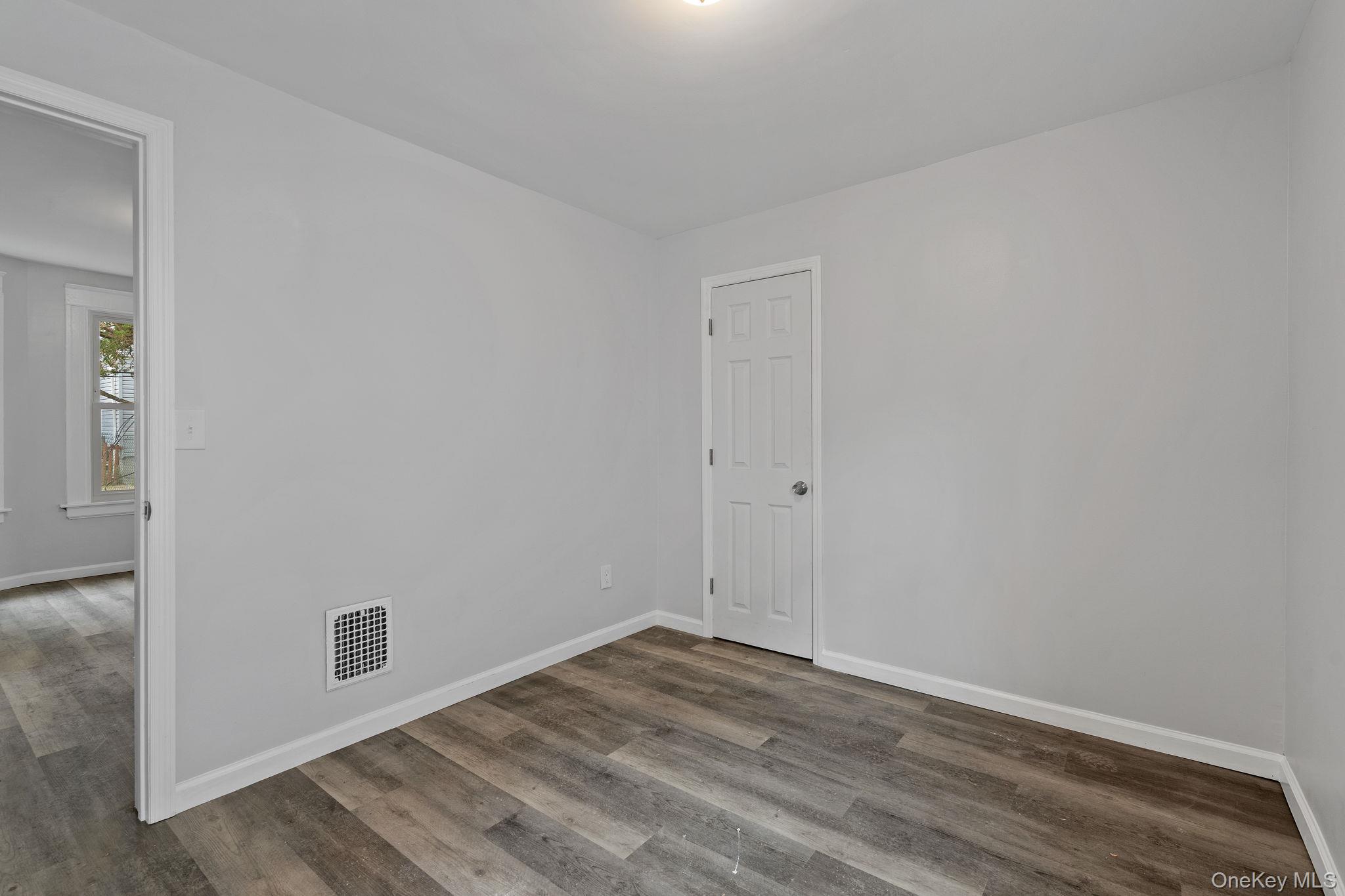 21 Lent Street Poughkeepsie, NY 12601 - Photo 11 of 47 Unfurnished room featuring baseboards and wood finished floors