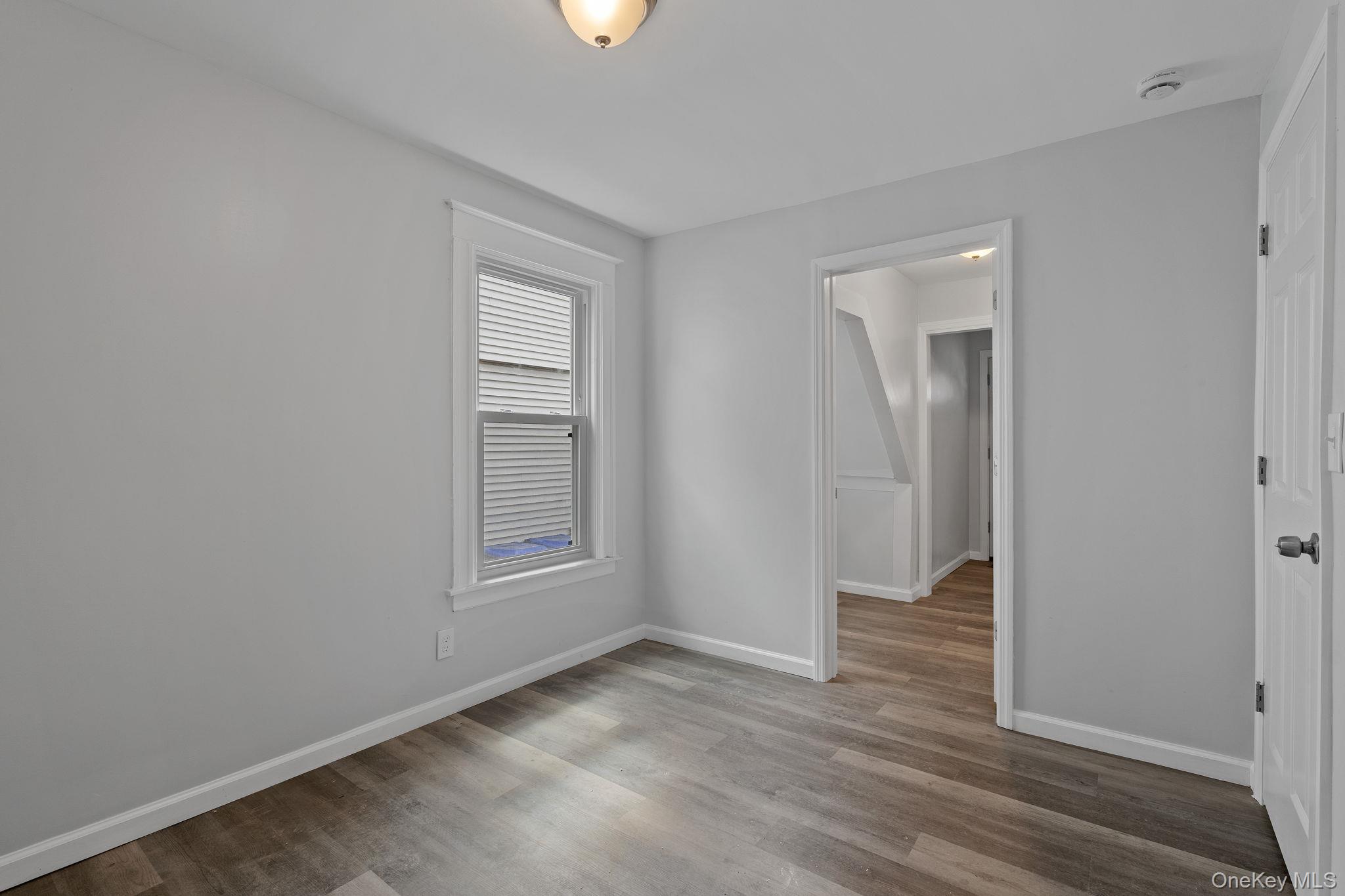 21 Lent Street Poughkeepsie, NY 12601 - Photo 13 of 47 Unfurnished bedroom with light wood-style flooring and baseboards