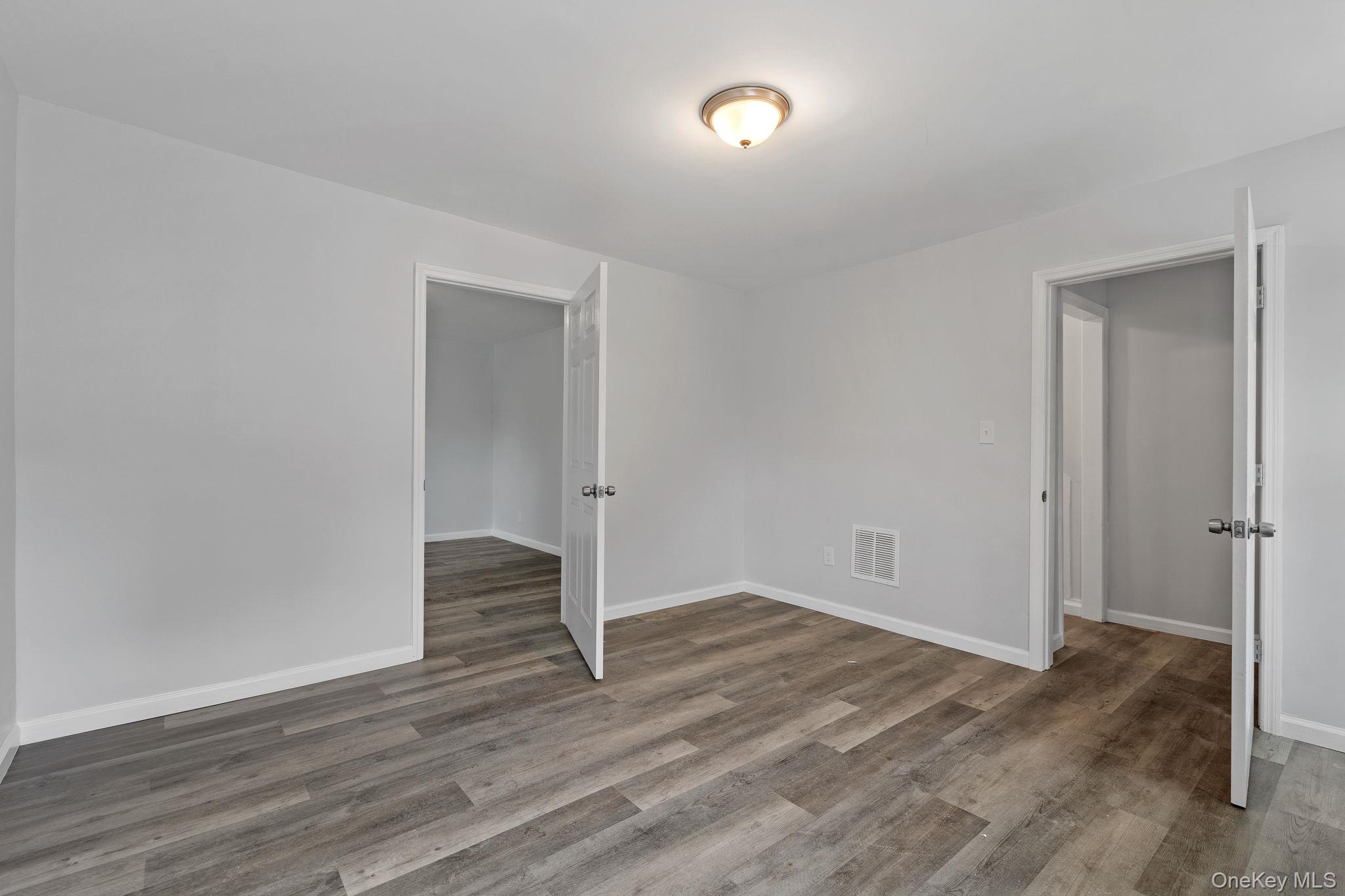 21 Lent Street Poughkeepsie, NY 12601 - Photo 15 of 47 Unfurnished room featuring wood finished floors and baseboards