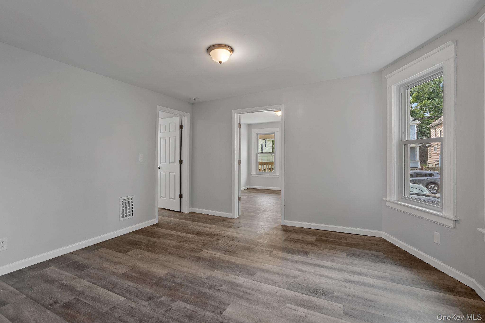21 Lent Street Poughkeepsie, NY 12601 - Photo 19 of 47 Spare room with plenty of natural light and wood finished floors
