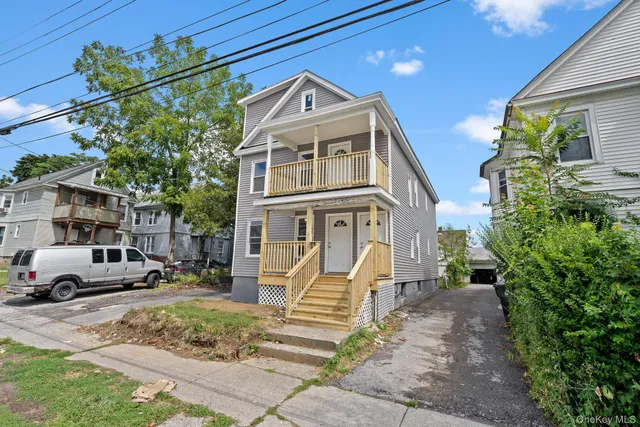 a front view of a house with a yard