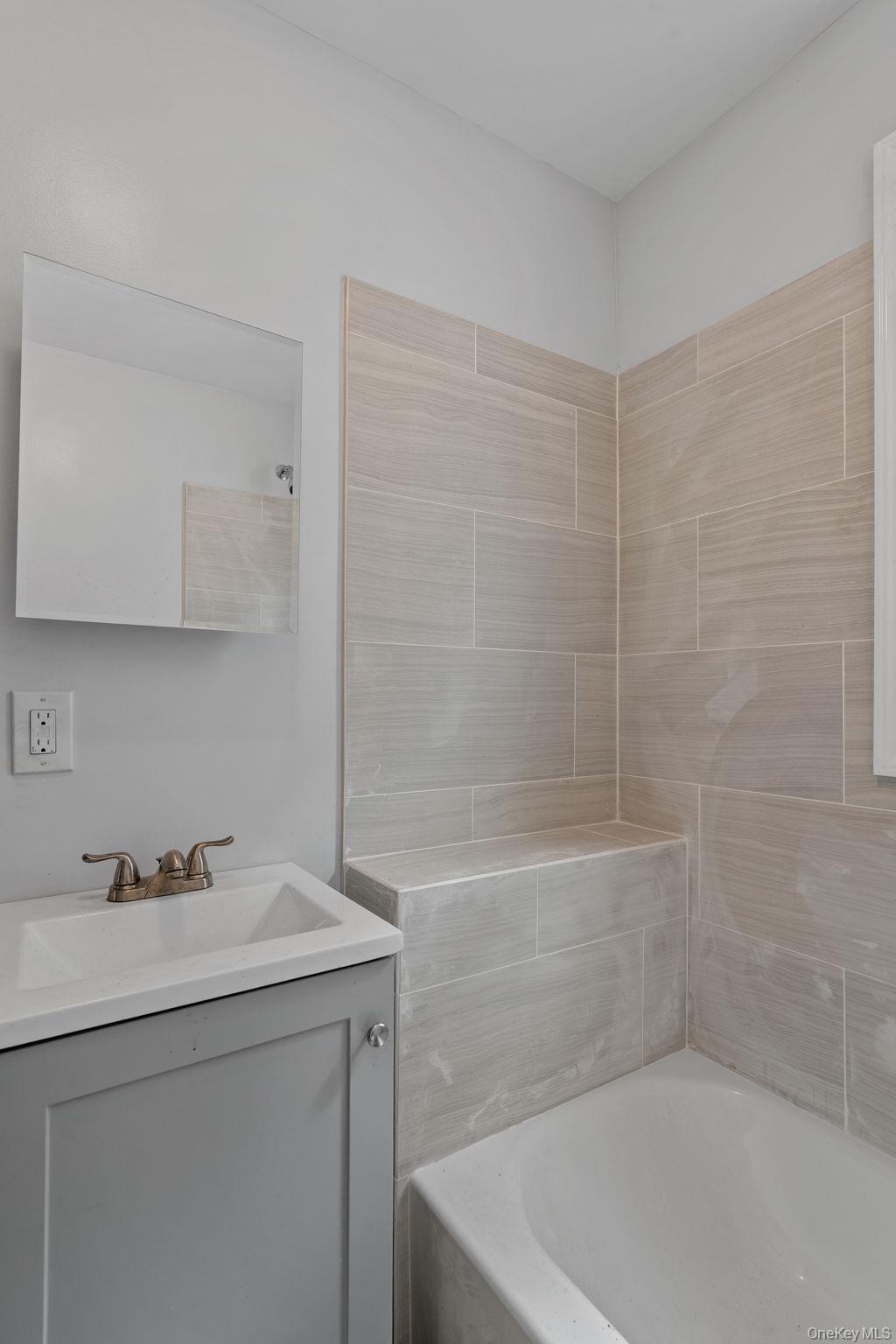 21 Lent Street Poughkeepsie, NY 12601 - Photo 26 of 47 Bathroom featuring vanity and shower / washtub combination