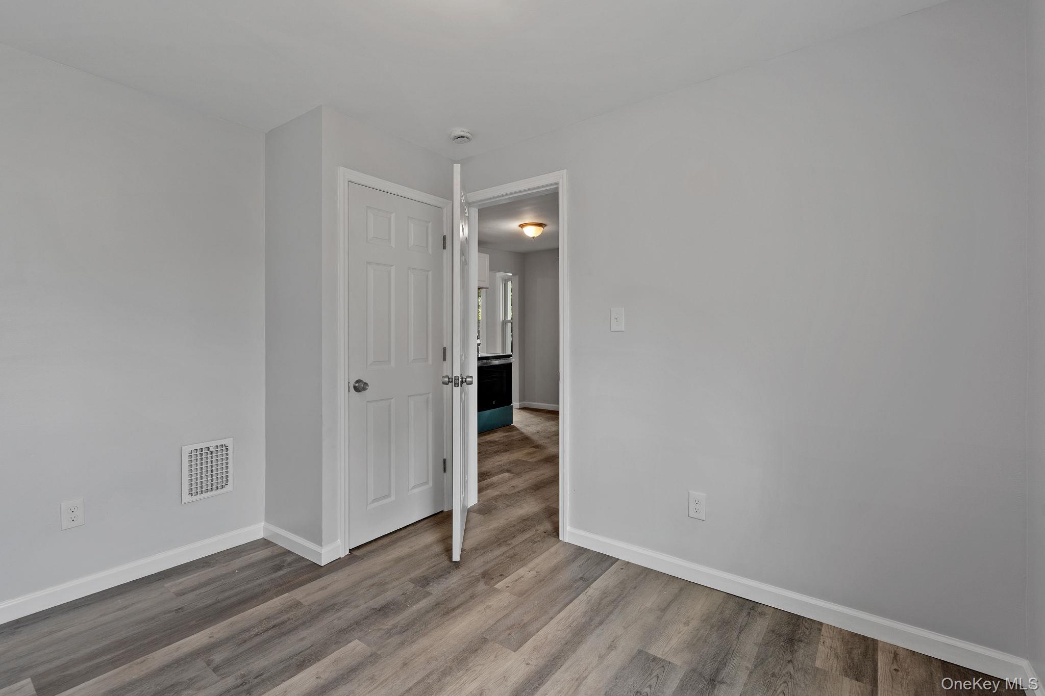 21 Lent Street Poughkeepsie, NY 12601 - Photo 28 of 47 Empty room featuring baseboards and wood finished floors