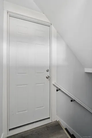 a bathroom with a glass shower door