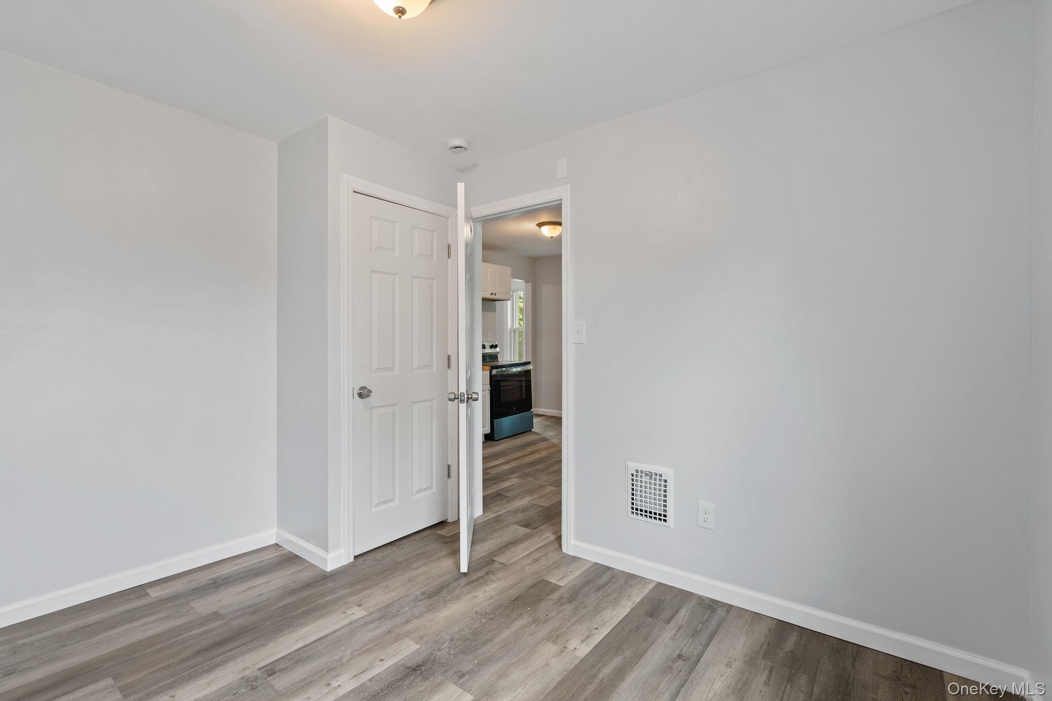 21 Lent Street Poughkeepsie, NY 12601 - Photo 37 of 47 Unfurnished room featuring baseboards and light wood-type flooring