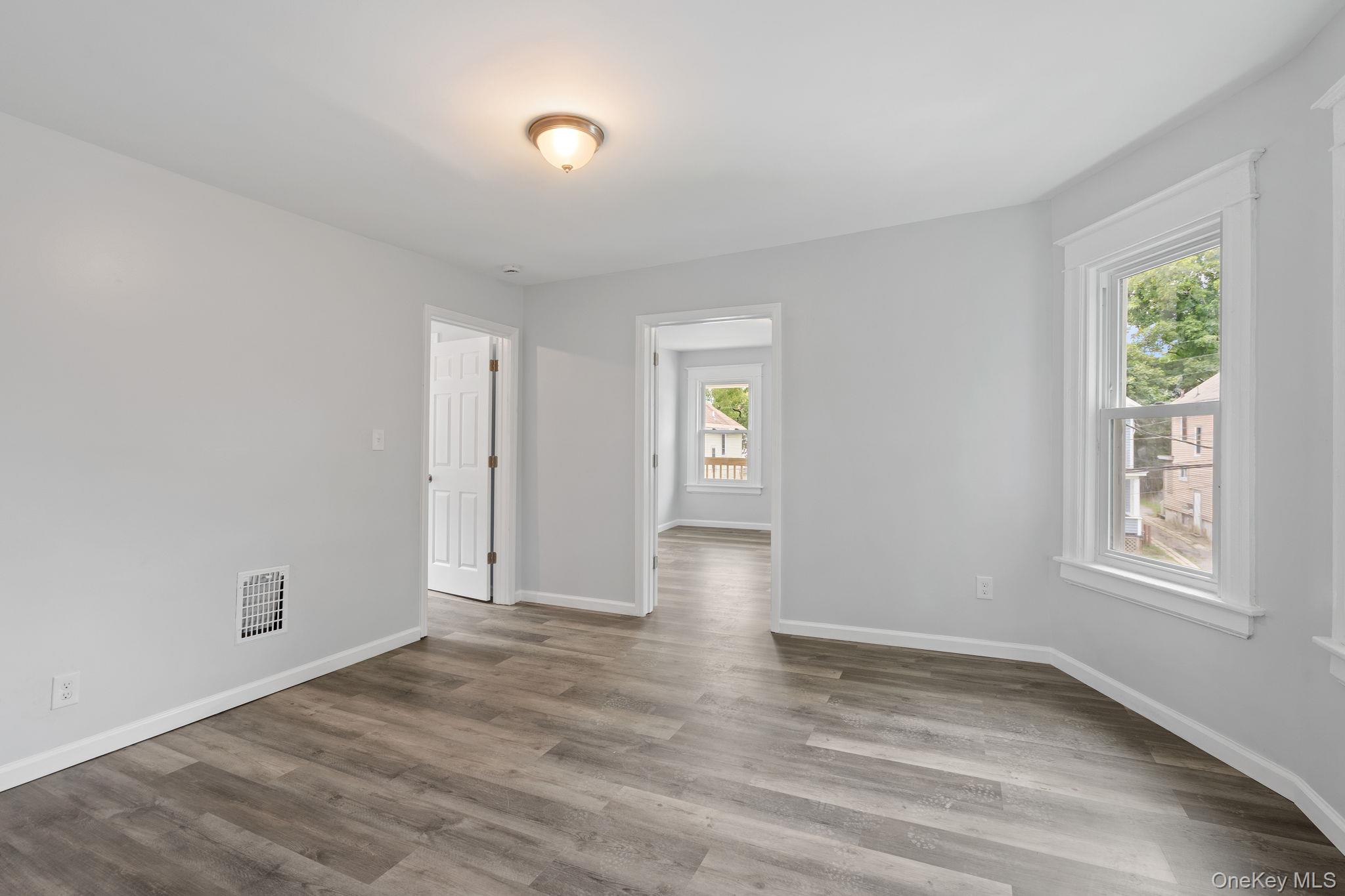 21 Lent Street Poughkeepsie, NY 12601 - Photo 38 of 47 Unfurnished room featuring wood finished floors and baseboards