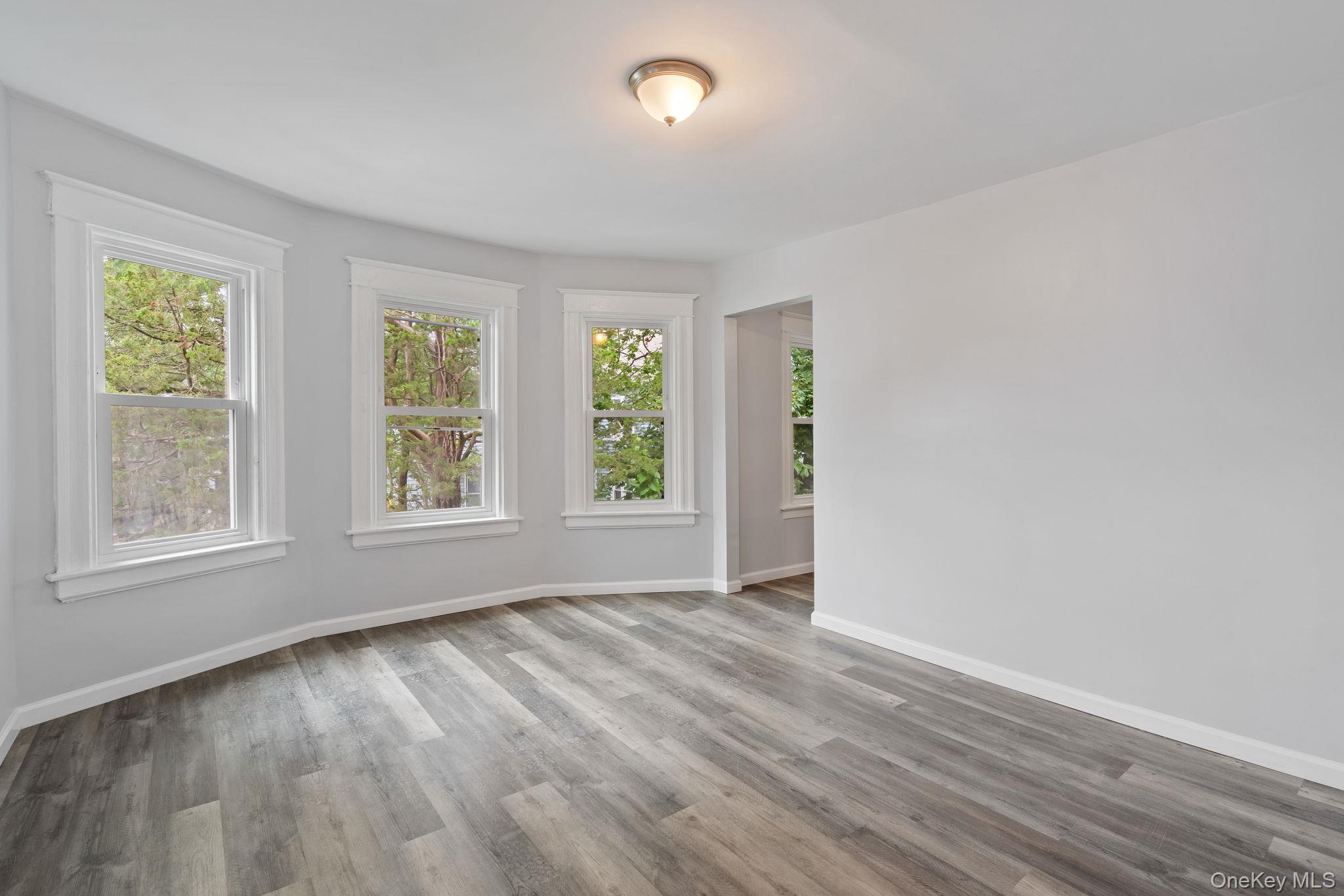 21 Lent Street Poughkeepsie, NY 12601 - Photo 40 of 47 Empty room with plenty of natural light and light wood-style floors