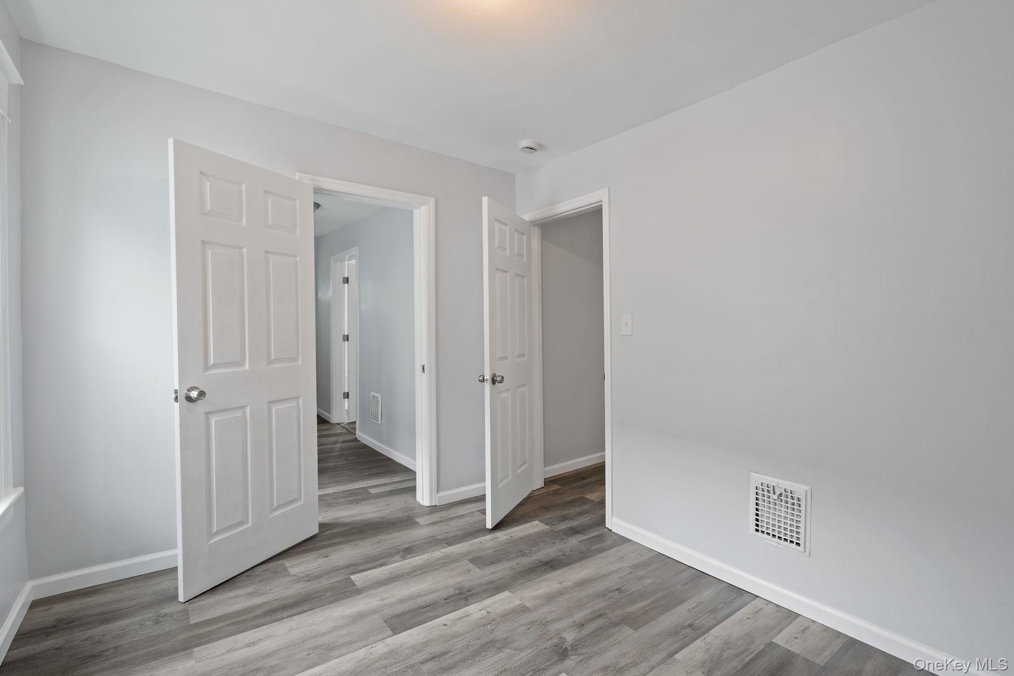 21 Lent Street Poughkeepsie, NY 12601 - Photo 42 of 47 Unfurnished room with light wood finished floors and baseboards