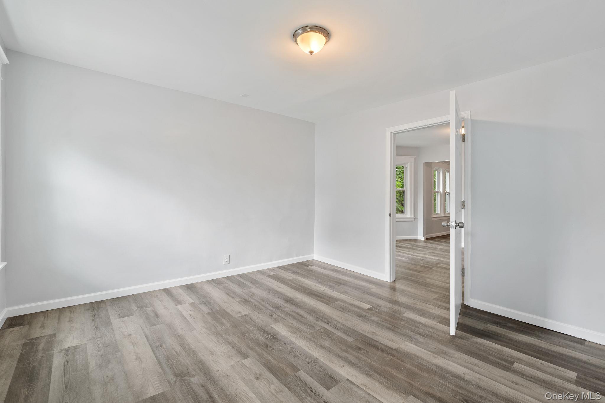 21 Lent Street Poughkeepsie, NY 12601 - Photo 45 of 47 Empty room with wood finished floors and baseboards