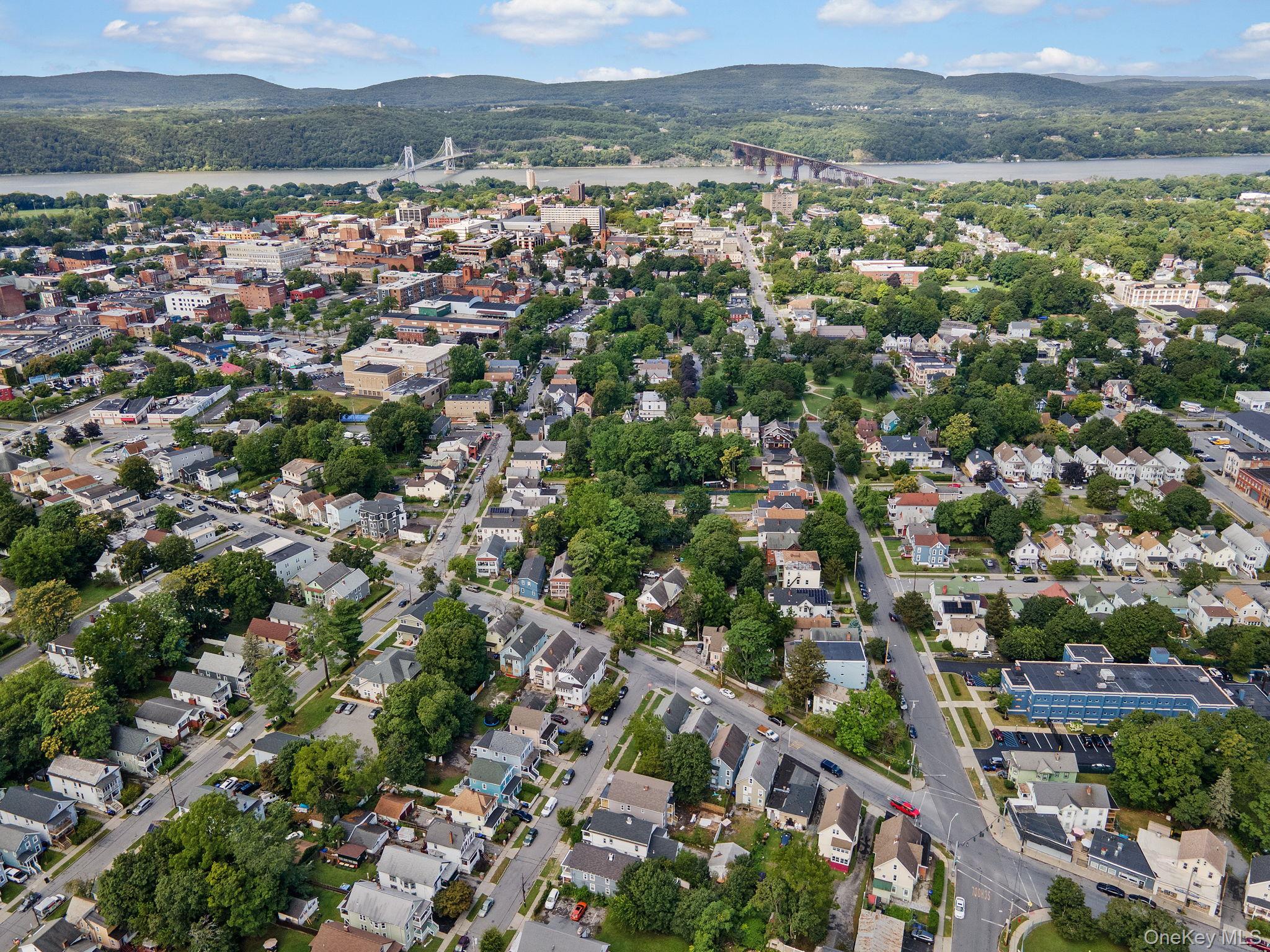 21 Lent Street Poughkeepsie, NY 12601 - Photo 47 of 47 Aerial overview of property's location with nearby suburban area, a notable bridge, and a water and mountain view