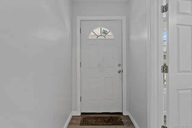 a view of a hallway with a door