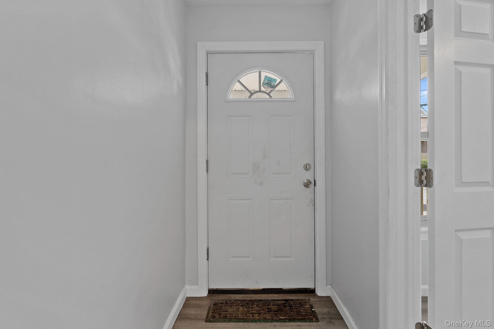 21 Lent Street Poughkeepsie, NY 12601 - Photo 8 of 47 Doorway to outside featuring baseboards and wood finished floors