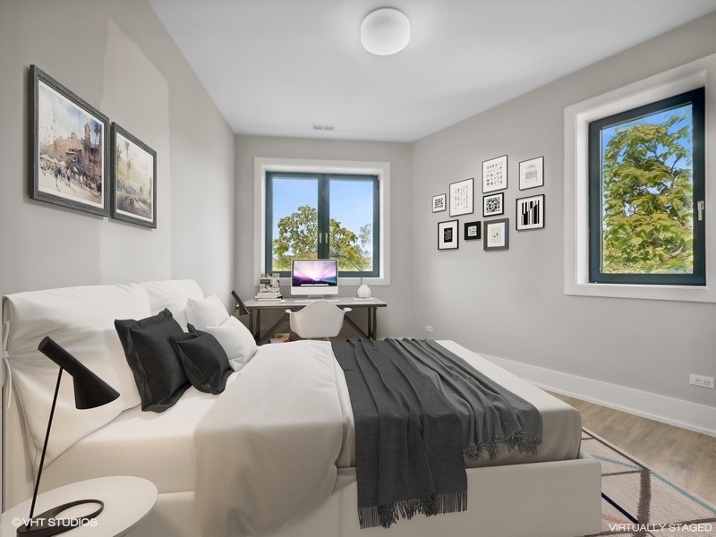 3839 North Clark Street, Unit 403 Chicago, IL 60613 - Photo 4 of 8 a bedroom with bed and a window