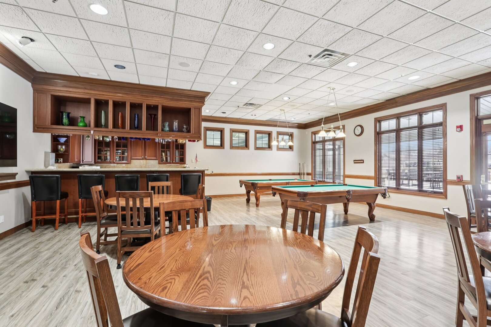 688 Cadillac Circle Romeoville, IL 60446 - Photo 33 of 45 a dining room with furniture window and wooden floor