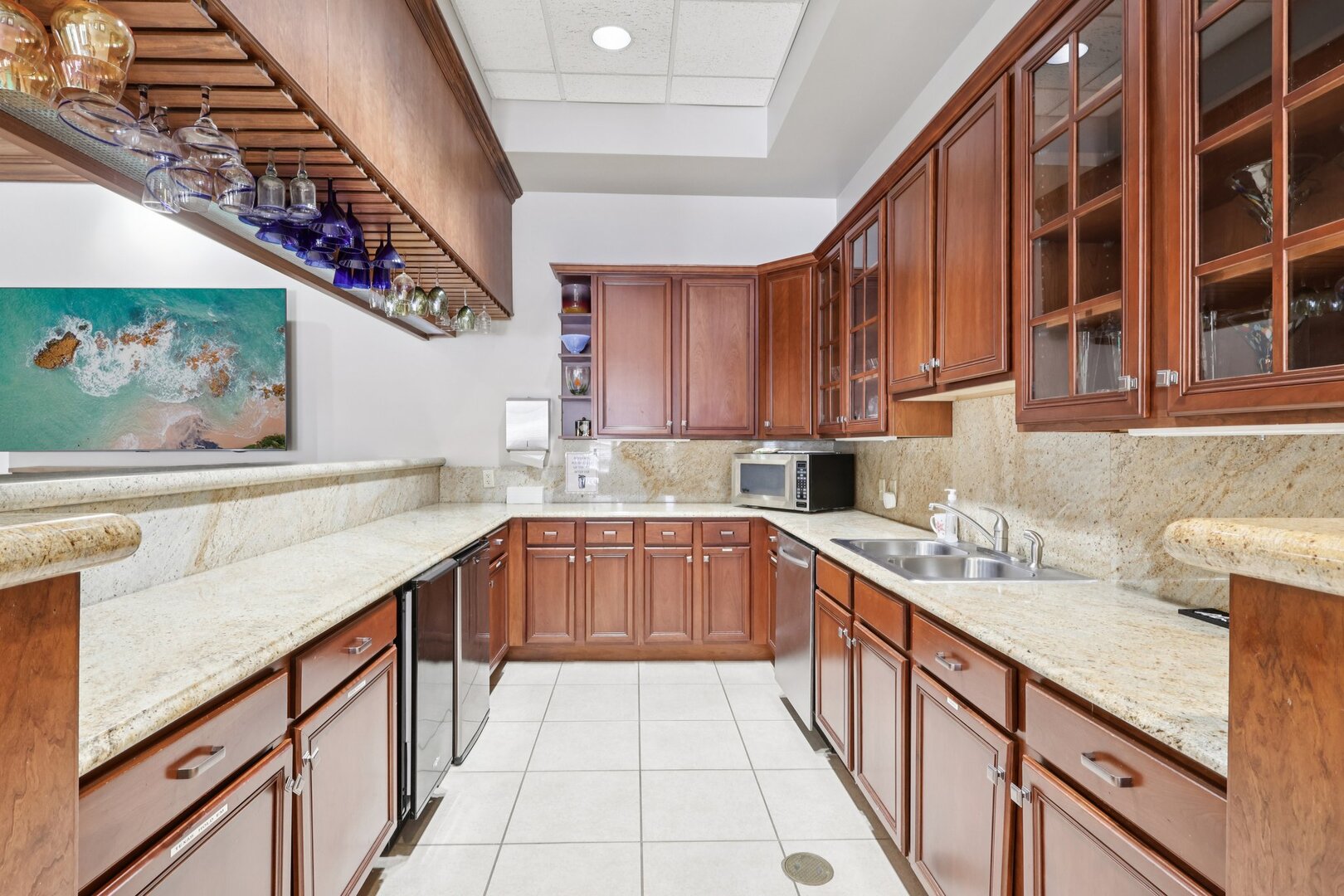 688 Cadillac Circle Romeoville, IL 60446 - Photo 35 of 45 a kitchen with stainless steel appliances granite countertop a sink and cabinets