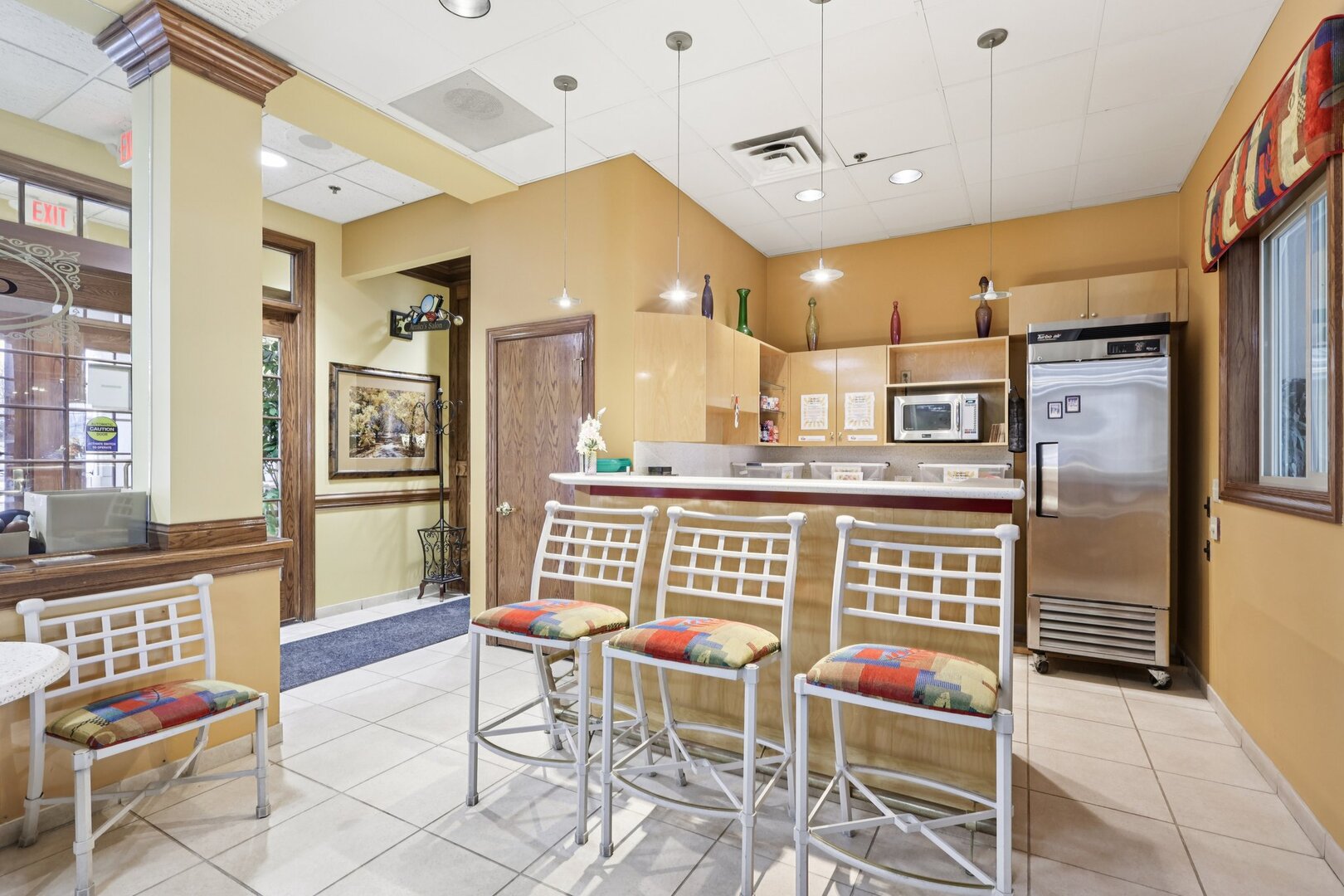 688 Cadillac Circle Romeoville, IL 60446 - Photo 37 of 45 a dining room with stainless steel appliances kitchen island granite countertop a table and chairs
