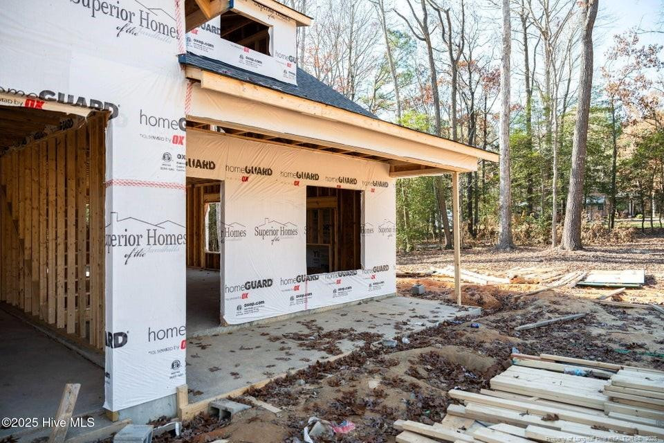 304 Monroe Road Cameron, NC 28326 - Photo 3 of 27 a backyard of a house with barbeque oven table and chairs