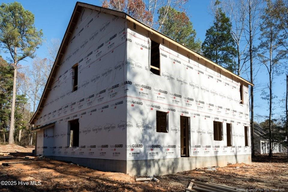 304 Monroe Road Cameron, NC 28326 - Photo 4 of 27 a view of a large building with large windows