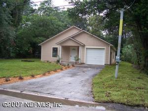 6803 Morgana Road North Jacksonville, FL 32211 - Photo 1 of 2 a backyard of a house with plants and garden