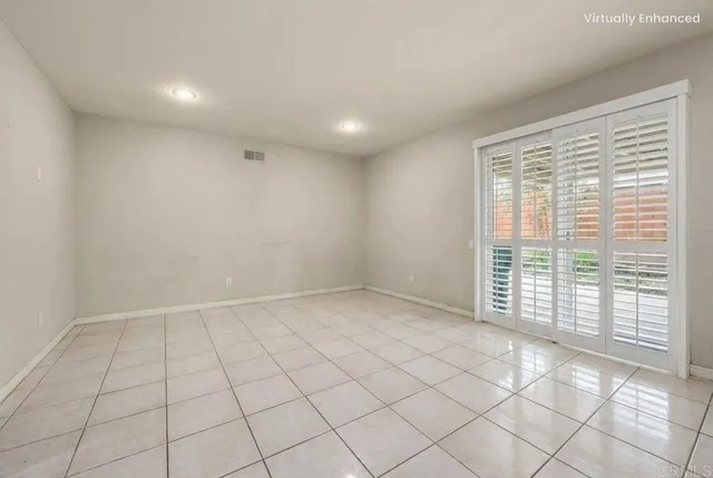 a view of an empty room and a window