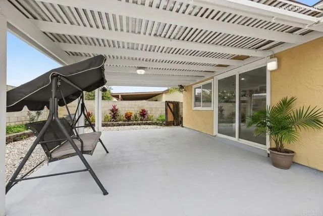 a view of an chairs and table in a patio