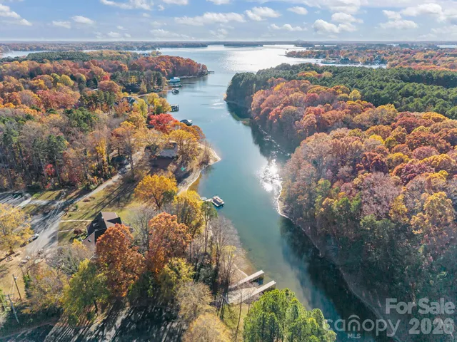 a front view of a brick house with a yard