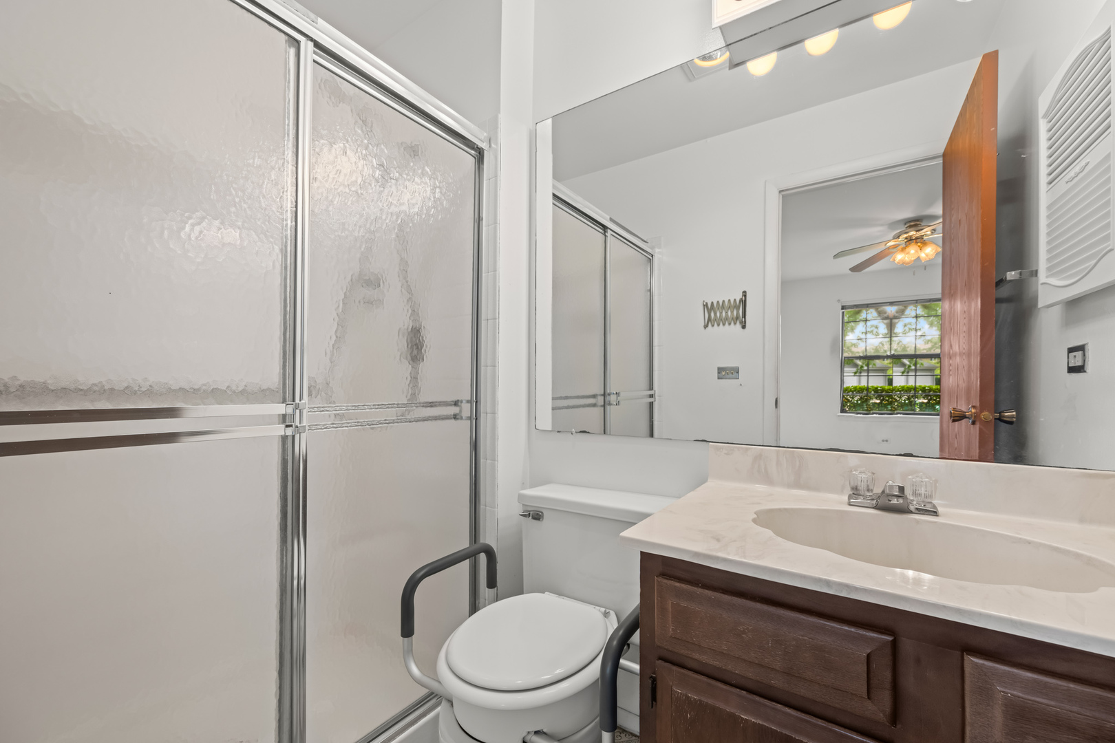1542 Springview Court, Unit B1 Wheeling, IL 60090 - Photo 11 of 14 a bathroom with a sink a toilet and shower